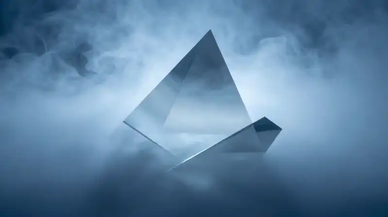 A fragmented glass prism silhouette swirls in blue mist