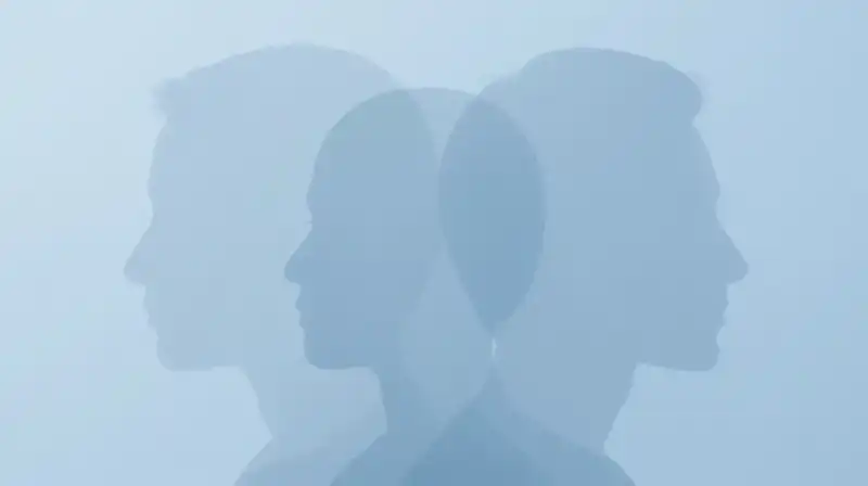 Translucent geometric silhouettes drift through a soft blue atmosphere