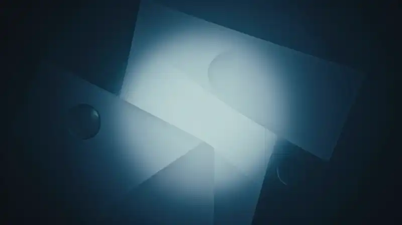Translucent geometric prisms and glowing spheres float in blue light