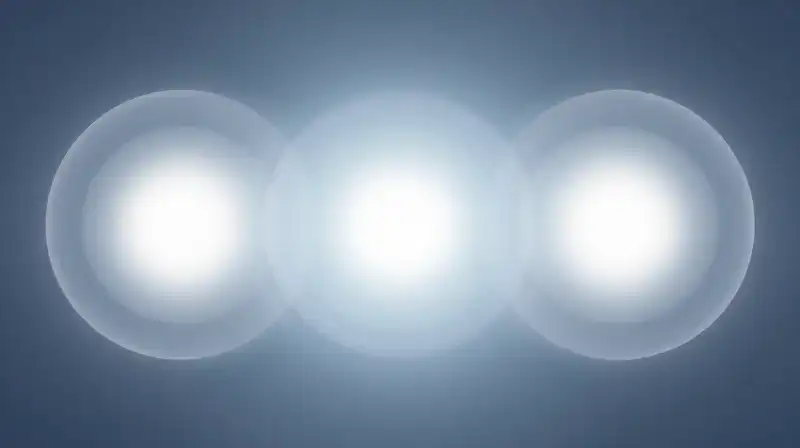 Four glowing translucent spheres float within a blue mist