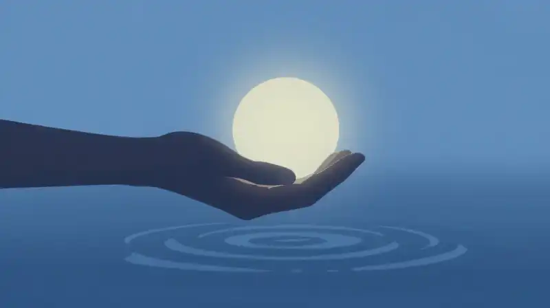 A gentle hand offers glowing light over rippling water