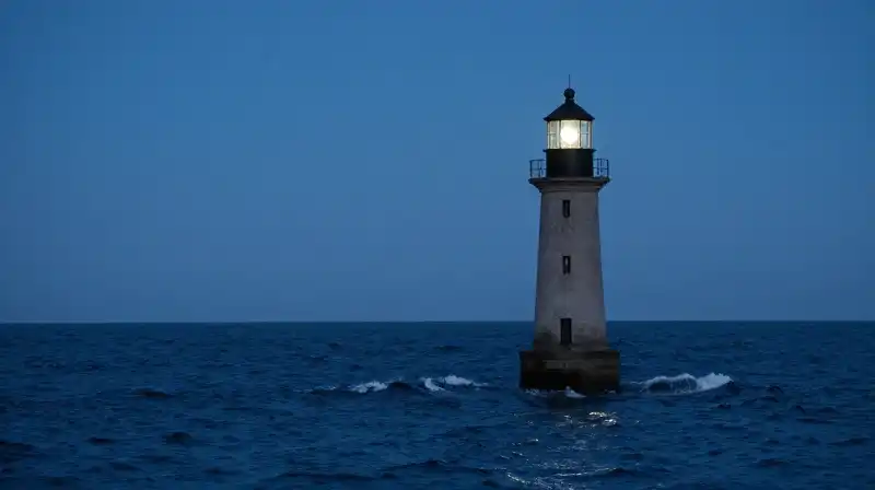 A lonely lighthouse silhouette stands against calm, moonlit blue waves