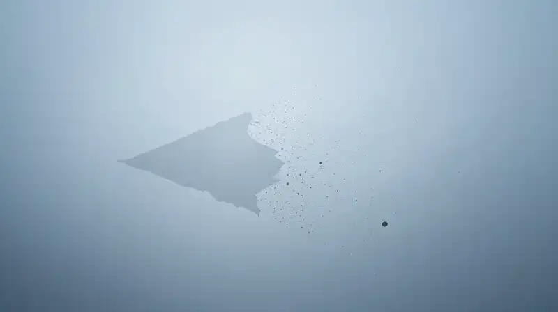 A translucent silhouette dissolves into geometric particles in blue haze