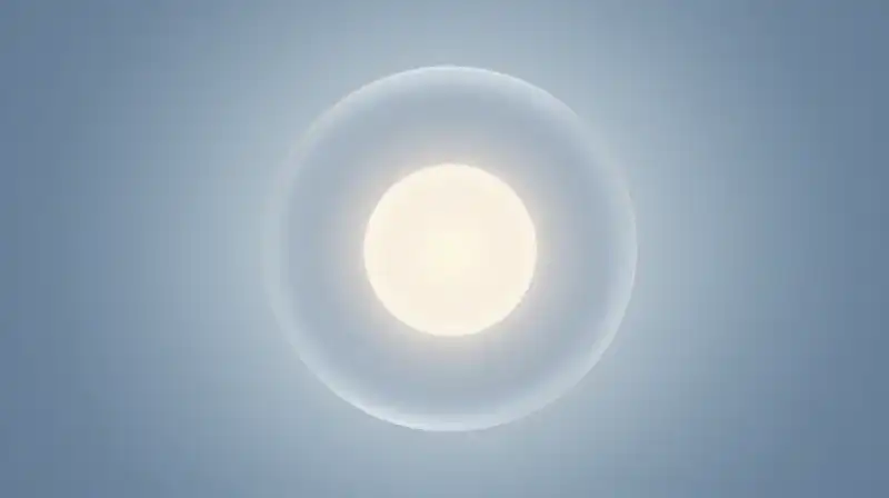 A glowing orb rests inside overlapping translucent blue spheres