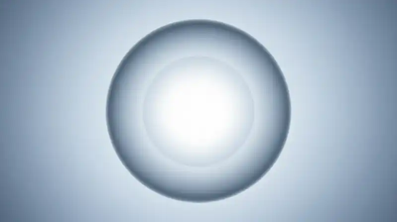 Glowing glass spheres with luminous cores float in blue mist