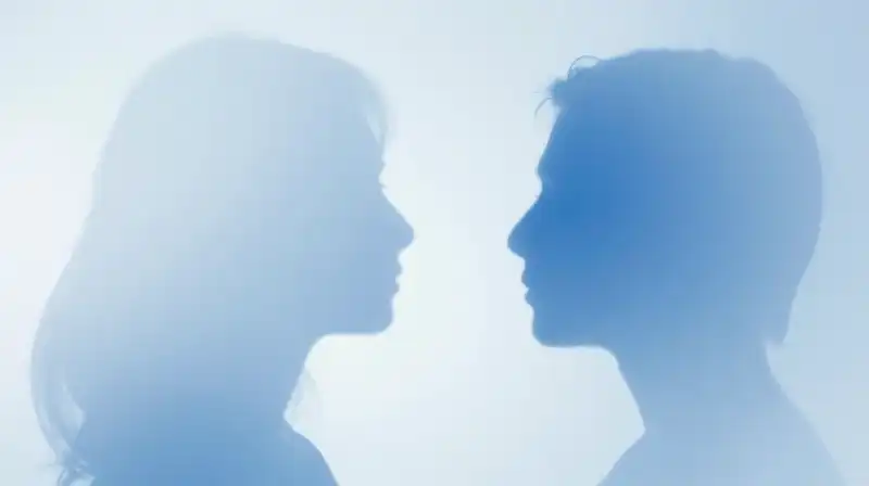 Two overlapping blue silhouettes, one flowing and one jagged