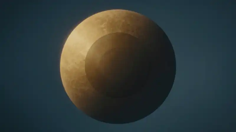A glowing sphere transitions from gold to deep shadow