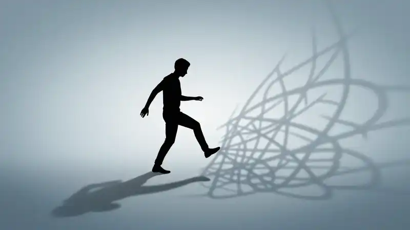 A silhouette steps through a complex geometric shadow pattern