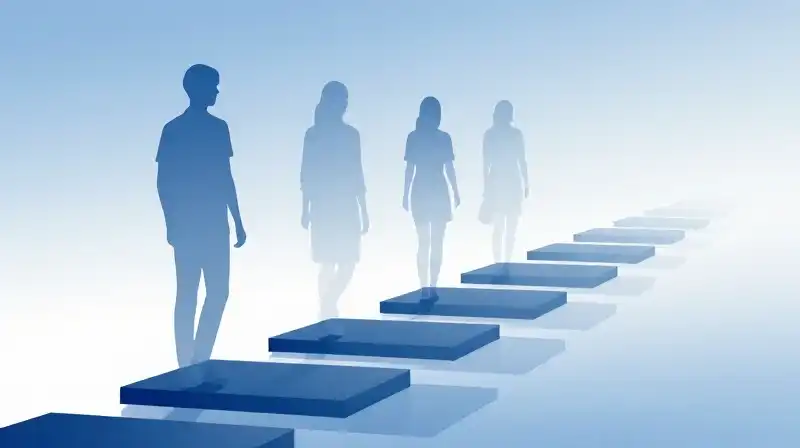 Translucent silhouettes step along blue geometric shapes toward light