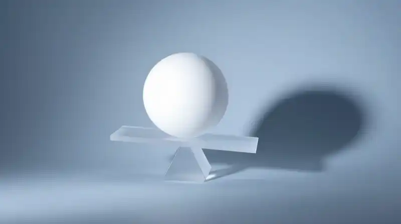 A translucent scale balances a glowing sphere against heavy shadow