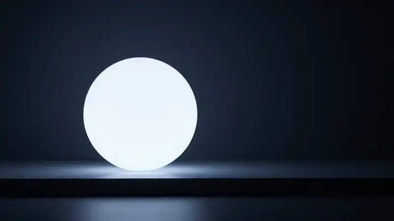 A glowing orb shines against subtle geometric patterns