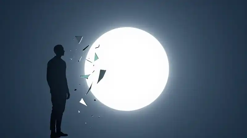 A glowing silhouette regains color amidst drifting mirror fragments