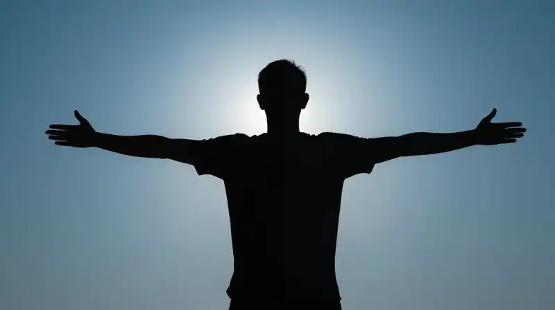 A split silhouette shows one radiant, expansive, one shadowed side