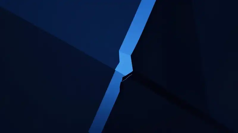 Dark geometric shapes overlap around a sharp, jagged central fracture