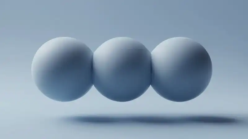 Interlocking geometric spheres float in a calm, blue atmosphere