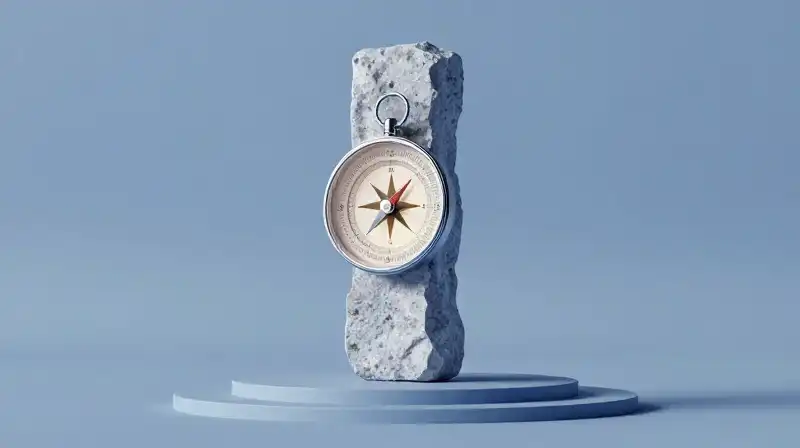 A glowing compass rests atop a balanced stone pillar