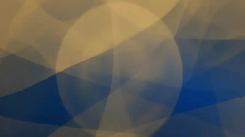 Translucent gold and deep blue silhouettes swirl in ethereal light