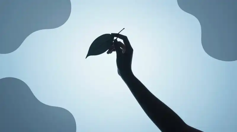 A curved silhouette grasps a leaf amidst floating organic shapes
