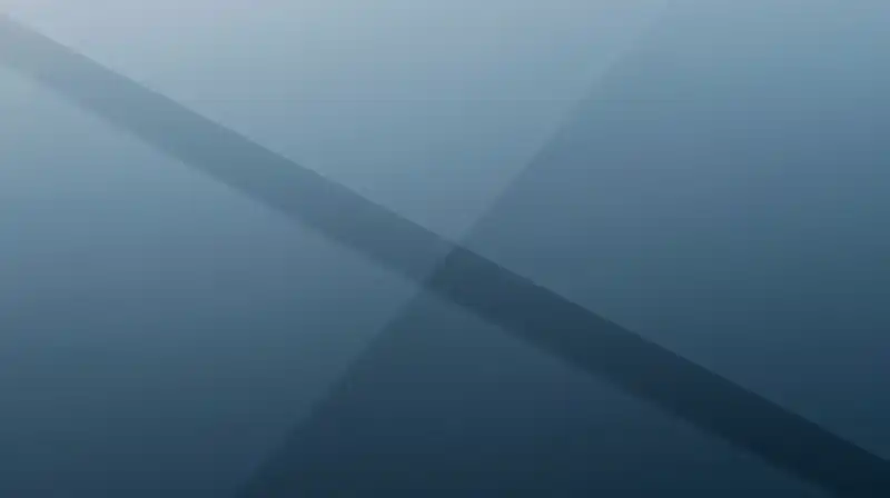 Two geometric paths diverge through a calm, blue space