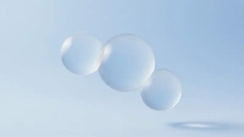 Three translucent spheres float among delicate geometric shapes