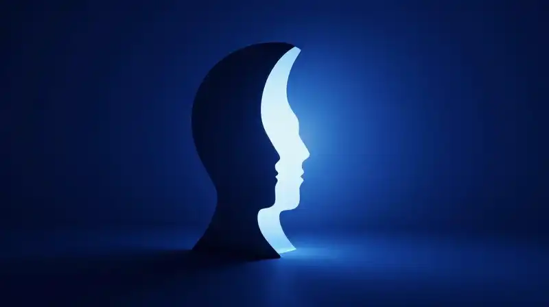A split silhouette glows with a hollow, radiant core